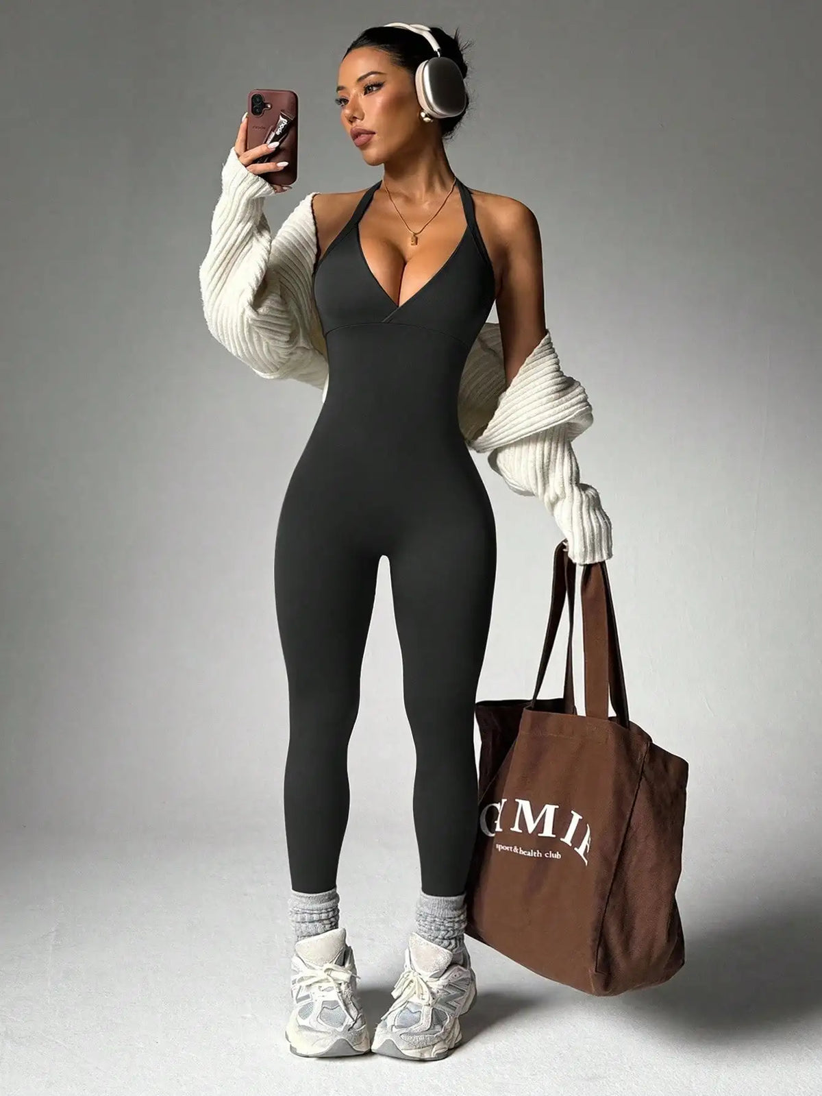 Close-up of smooth, supportive fabric stretch on Vela Sculpt Jumpsuit